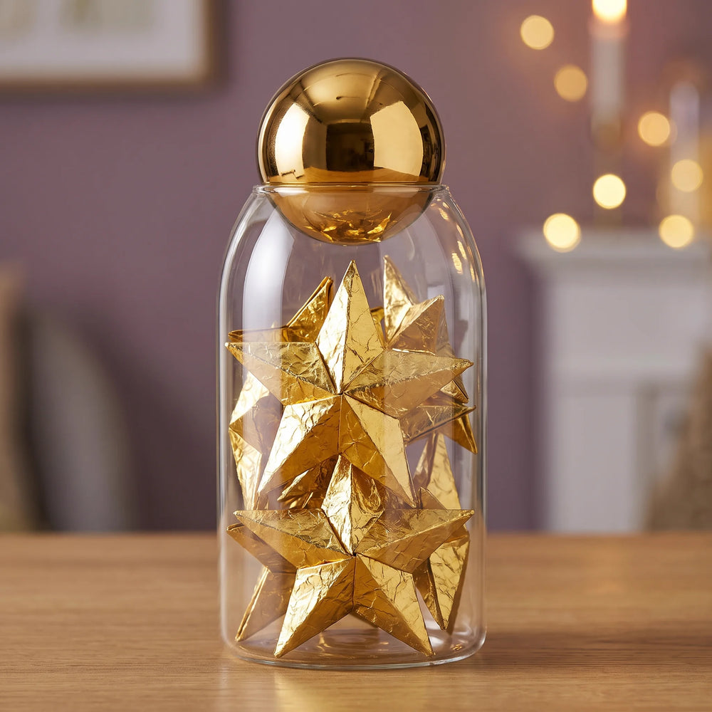 Folded gold stars in warm lamplight
